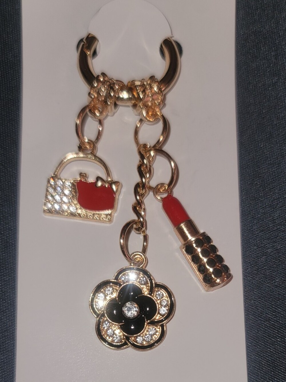 Gold-tone Charm Keychain with Black Flower and Red Lipstick Charm